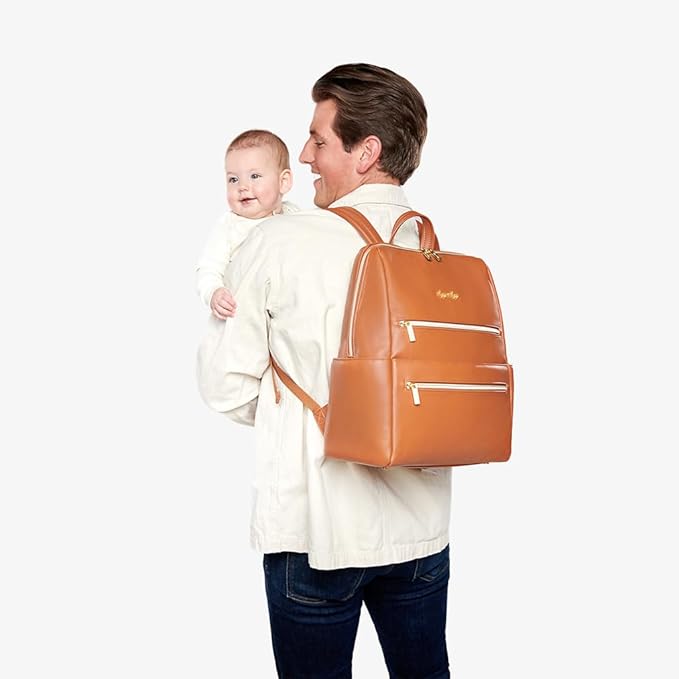 Itzy Ritzy Eras Diaper Bag Backpack – Large Capacity Backpack Diaper Bag Featuring Sleek Design, 15 Pockets, Changing Pad, Stroller Straps, and Luggage Sleeve (Cognac)