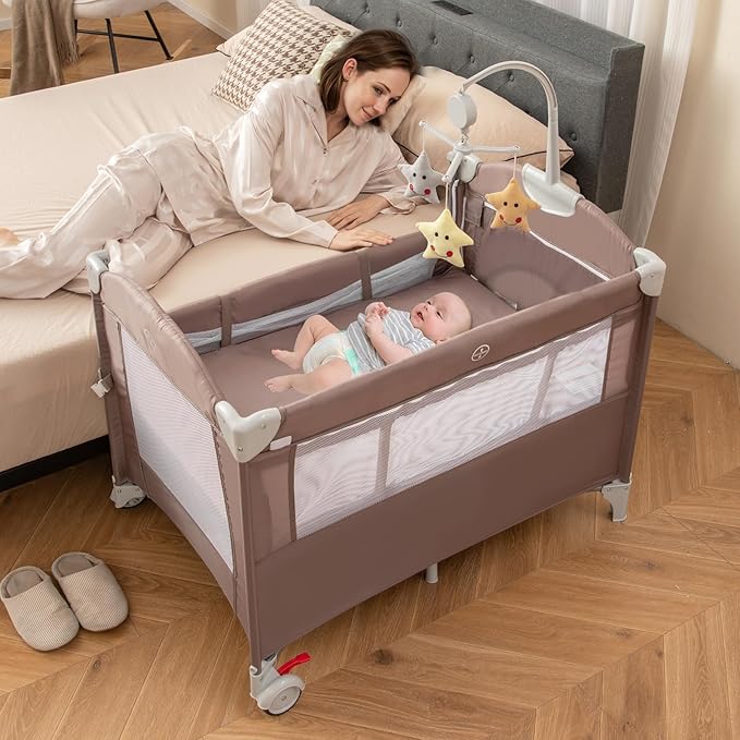 HONEY JOY Pack and Play with Bassinet, 5-in-1 Baby Bedside Sleeper w/Diaper Changing Table & Storage Bag, Toy Arch & Music Box, Detachable Side Rail, Portable Baby Play Yard w/Carry Bag(Coffee)