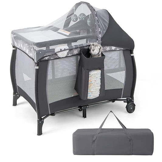 HONEY JOY Pack and Play with Bassinet, 4-in-1 Portable Baby Playard with Changing Table, Net & Cute Toys, Diaper Storage Bag, Music Box, Wheels with Brake, Foldable Newborn Play Yard w/Carry Bag