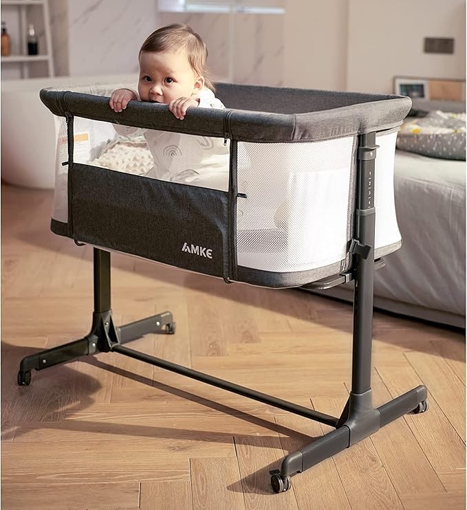 AMKE Baby Bassinet Bedside Sleeper, Portable Bassinet with Wheels, 6-Height Adjustable & Fold Down Side, Full Breathable Mesh Bedside Crib for Baby with Mattress Pad, Easy to Install, Dark Grey