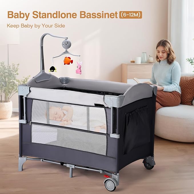 JOYMOR 4 in 1 Pack and Play, Baby Bedside Bassinet, Sturdy Play Yard with Padded Mat and Toy bar with Soft Toys