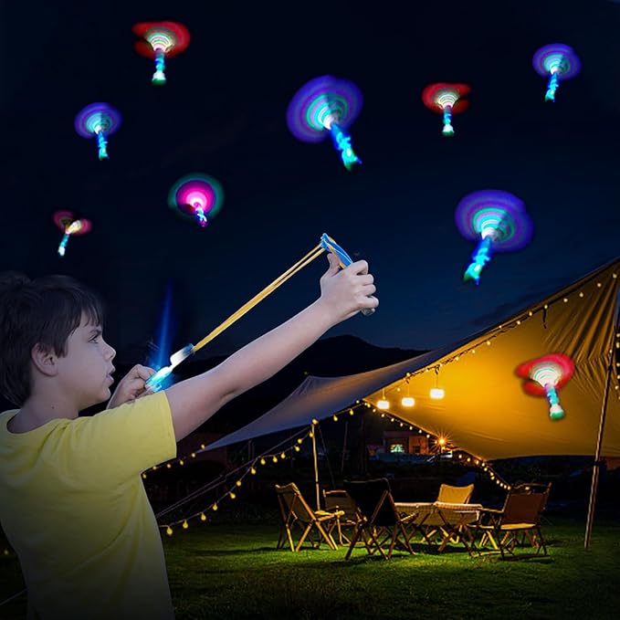 50 Pcs Slingshot Flying Toys with Led Lights,25 Pcs LED Arrow Helicopters + 25 Pcs Launchers,Summer Outdoor Game Glow in The Dark Party Supplies Party Favors for Kids 4-8,8-12 Bulk Toys