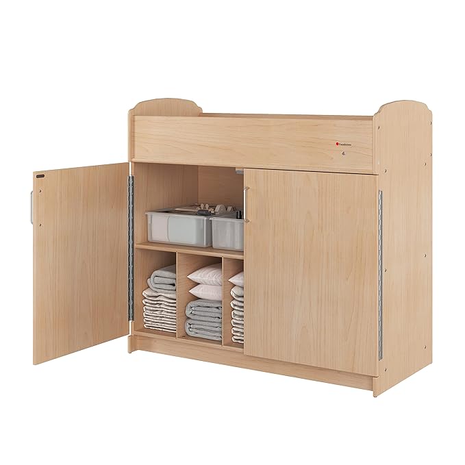 Foundations Serenity Daycare Changing Table with Storage Cubbies, Durable Wood Construction, Built-in Shelving for Ample Storage, Adjustable Safety Strap, Includes 1” Foam Mattress Pad (Natural)