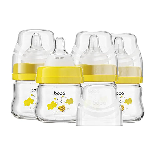YOHKOH Glass Baby Bottles with Slow Flow Nipple, Newborn Anti-Colic Baby Bottles for 0+ Months, Wide Neck Feeding Bottle, Clear (Yellow, 2.7oz (Pack of 4))