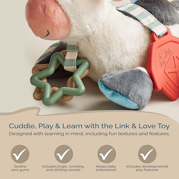Itzy Ritzy Link & Love Toy for Stroller or Car Seat; Features Textured Ribbons, Crinkle Sounds, Clinking Rings & Silicone Teether; Designed for Ages 0 Months and Up (Cow)