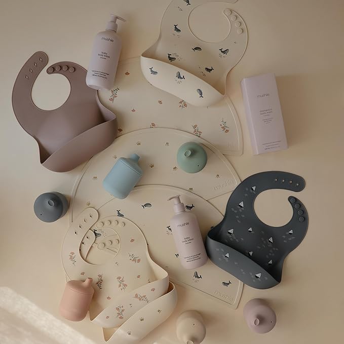 mushie Silicone Baby Bib | Adjustable Fit Waterproof Bibs (Pink Flowers)