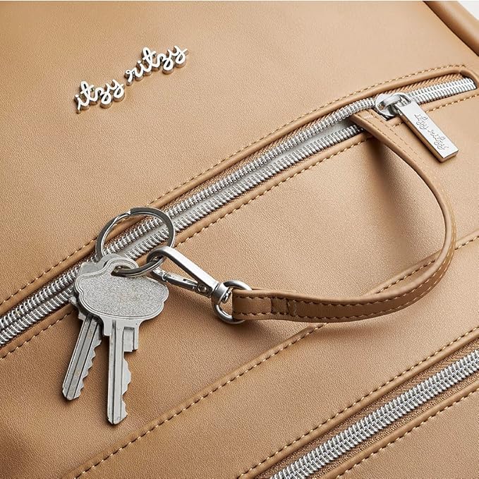 Itzy Ritzy Eras Diaper Bag Backpack – Large Capacity Backpack Diaper Bag Featuring Sleek Design, 15 Pockets, Changing Pad, Stroller Straps, and Luggage Sleeve (Chai)