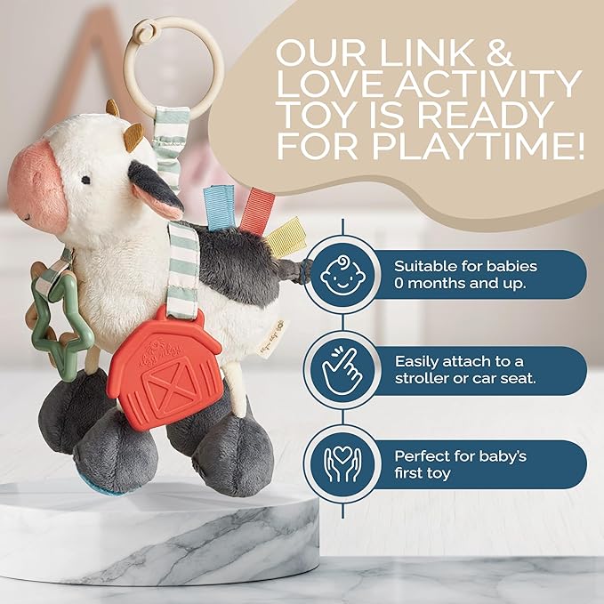 Itzy Ritzy Link & Love Toy for Stroller or Car Seat; Features Textured Ribbons, Crinkle Sounds, Clinking Rings & Silicone Teether; Designed for Ages 0 Months and Up (Cow)