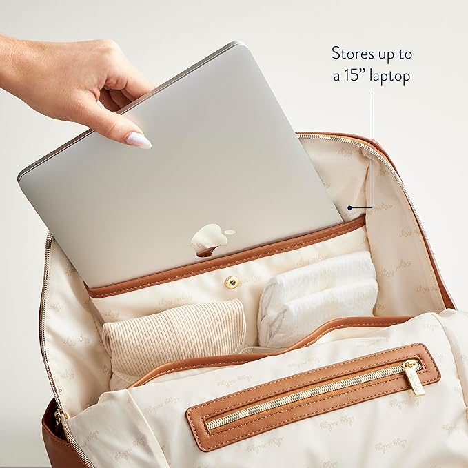 Itzy Ritzy Eras Diaper Bag Backpack – Large Capacity Backpack Diaper Bag Featuring Sleek Design, 15 Pockets, Changing Pad, Stroller Straps, and Luggage Sleeve (Cognac)